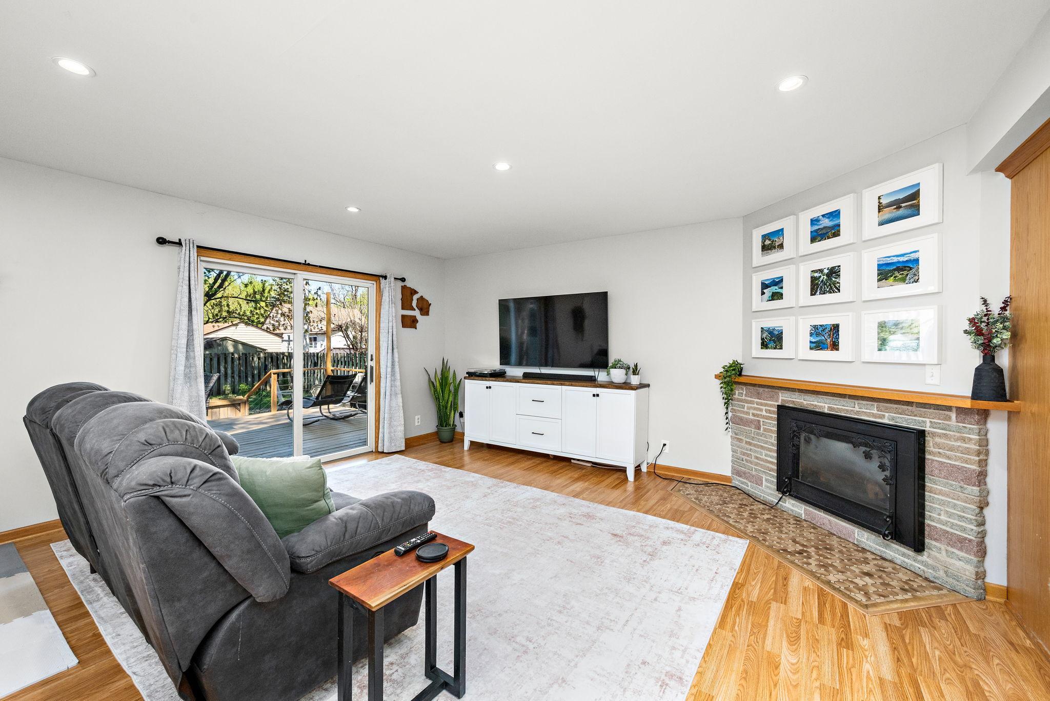 Spacious living room that leads out to the huge deck with an incredible back yard.