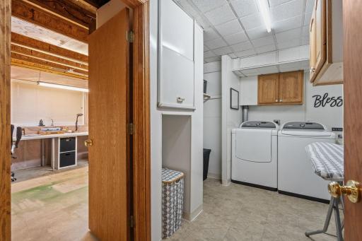 The laundry room provides additional storage and has a secret bonus - access to a bonus room connected to the garage!