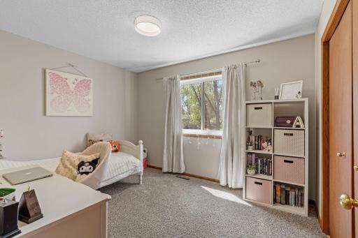2nd bedroom on the upper level with backyard views and a spacious closet