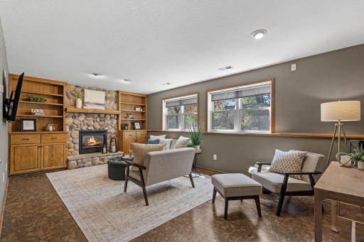Make your way down to the lower level - stone fireplace with lookout windows to the backyard.