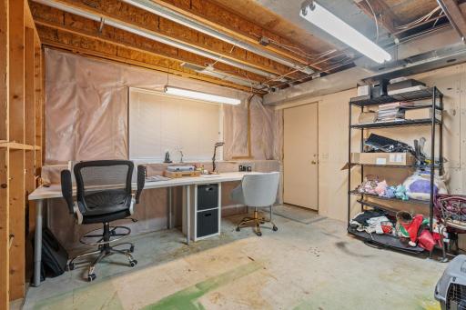 The bonus room! Additional access to the garage - great as a craft space, extra office, or future workshop.
