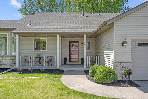 The welcoming front porch is perfect for a morning cup of coffee or watching kids play in the cul-de-sac.