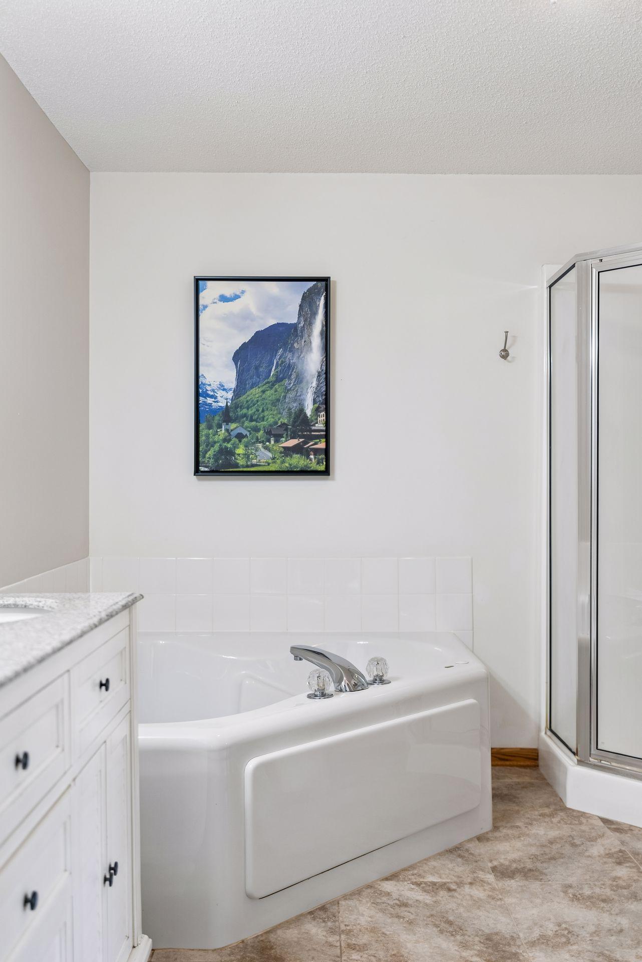 A large corner jetted tub is a welcome retreat for your well-deserved evening escape.