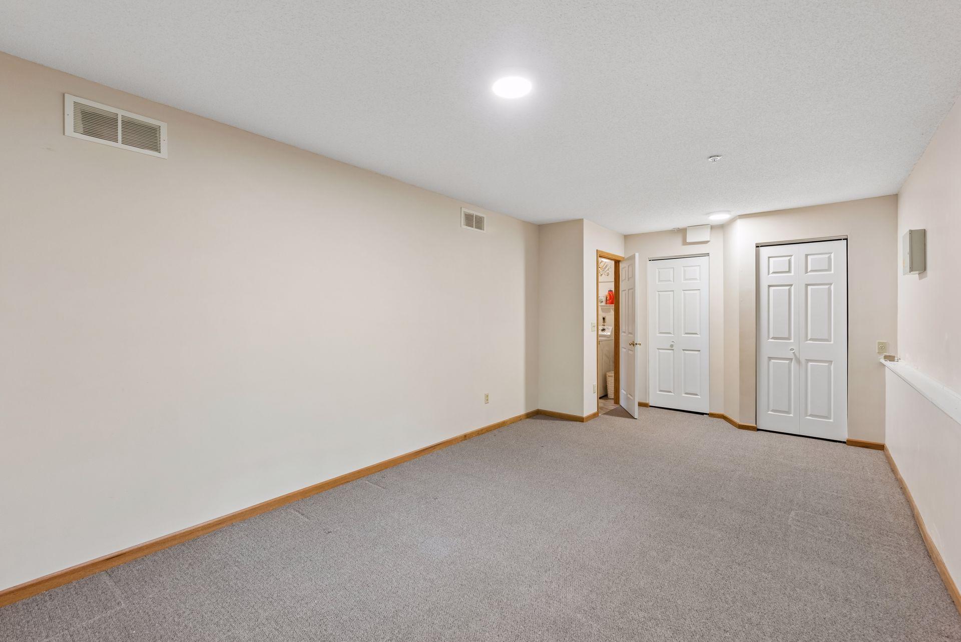 A large, finished room with daylight windows on the lower level is perfect for use as a family room, playroom, office, or guest bedroom.