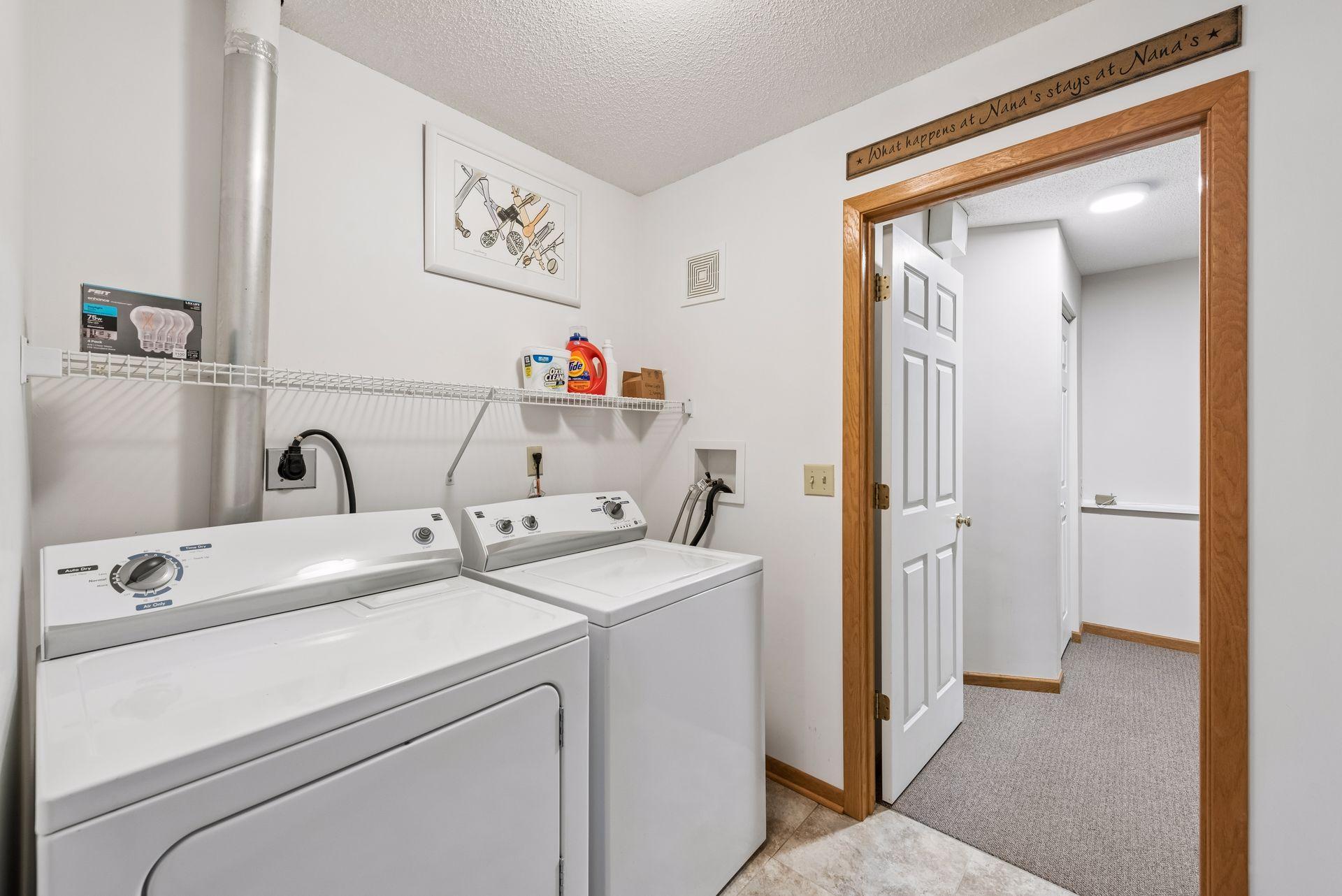 Tiled laundry & mud room provides functional space at the garage entry.