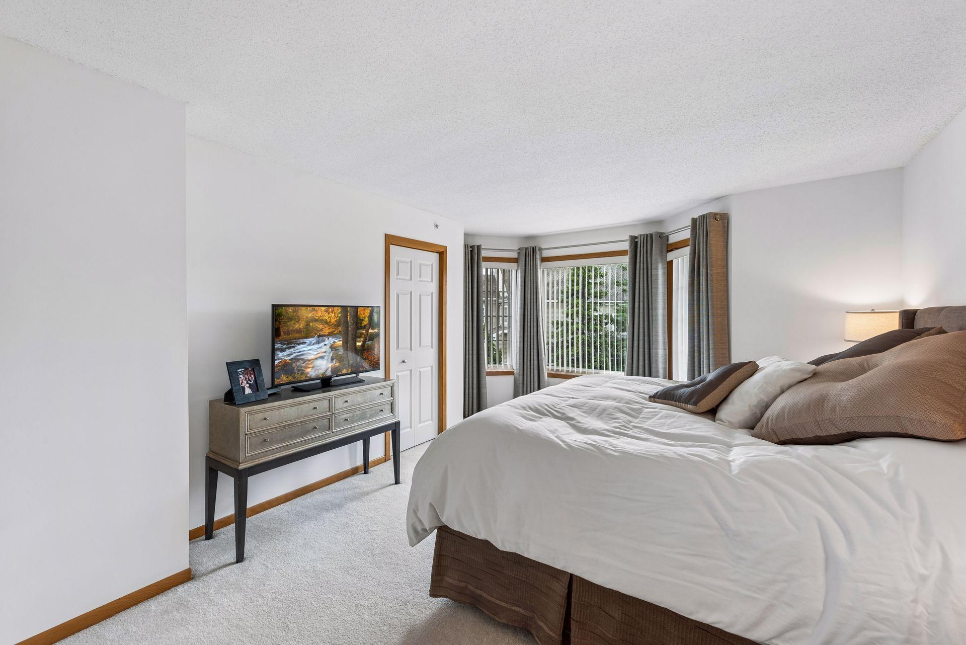 The spacious master features a bay window and an exceptionally large walk-in closet with built-in organizers.