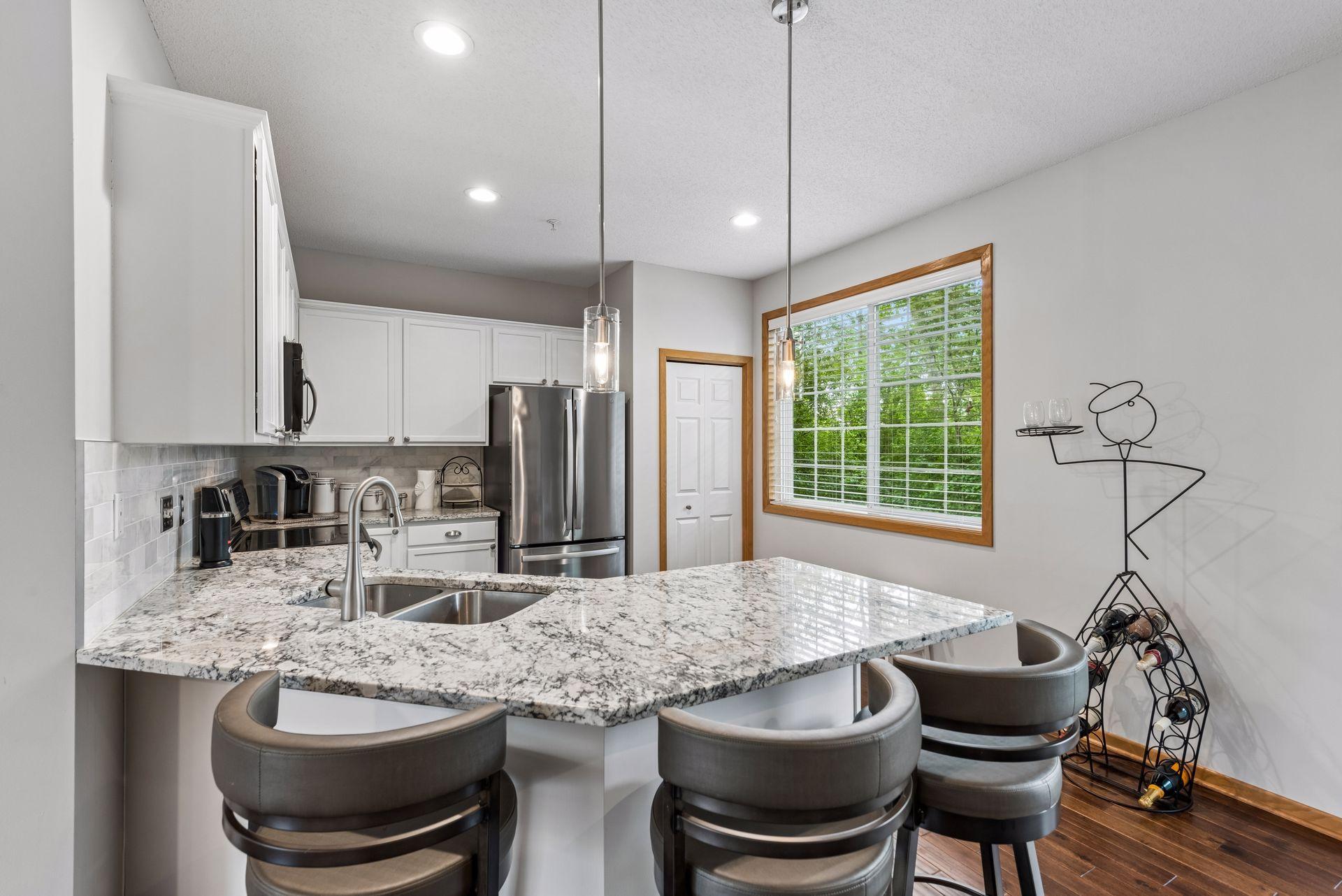 Kitchen boasts plenty of space to cook & create with a handy pantry closet for added storage.