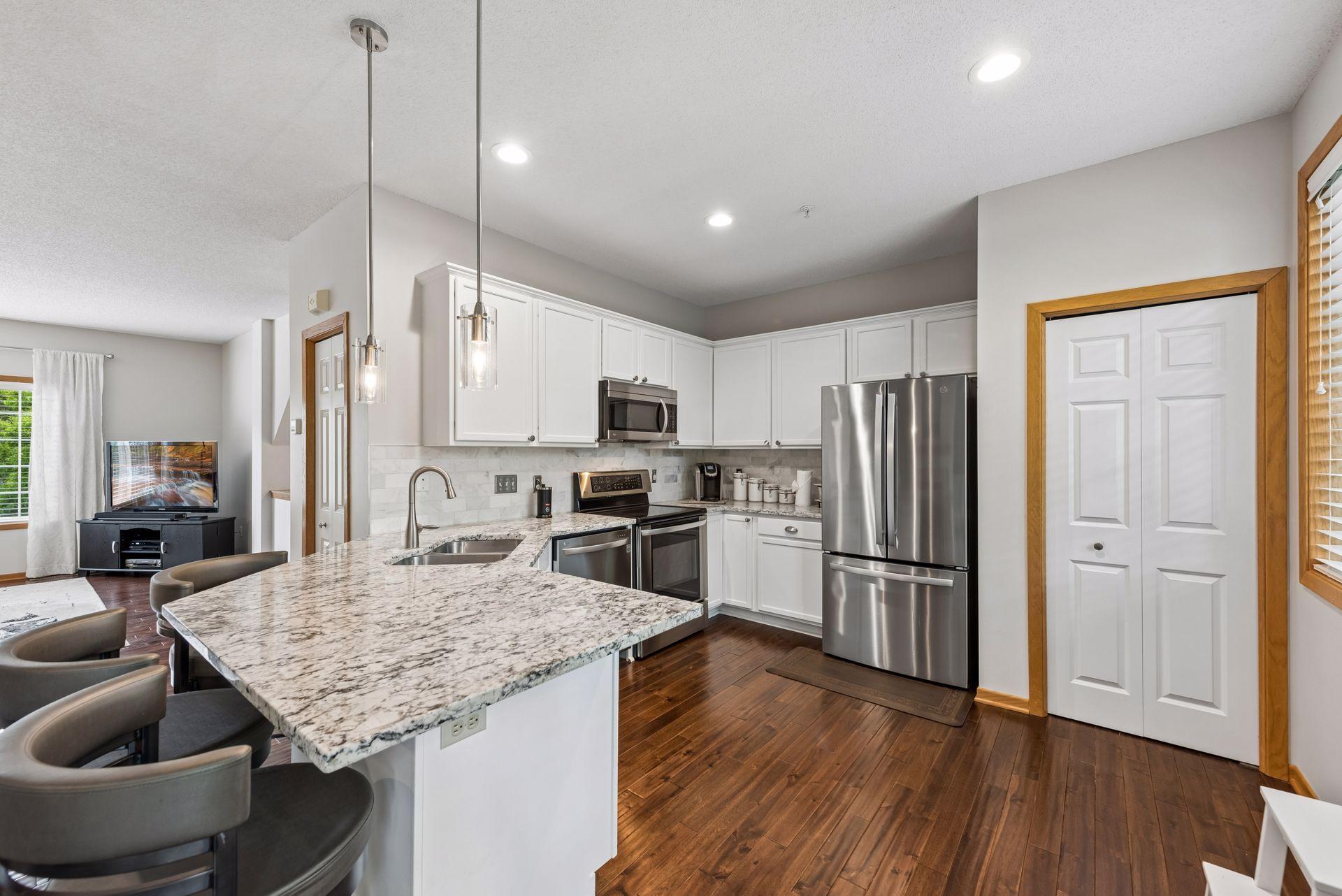 Kitchen boasts plenty of space to cook & create with a handy pantry closet for added storage.