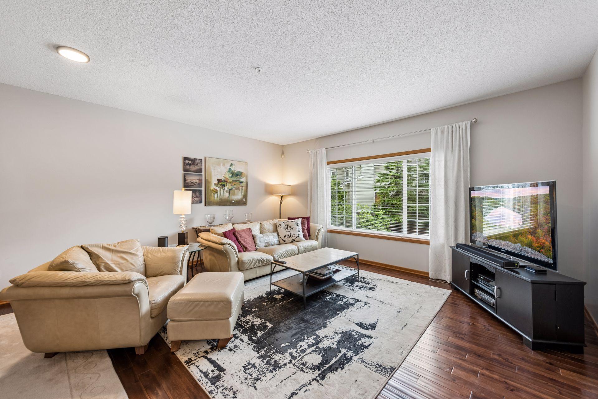 Spacious living room is ideal for evening relaxation and time with family.