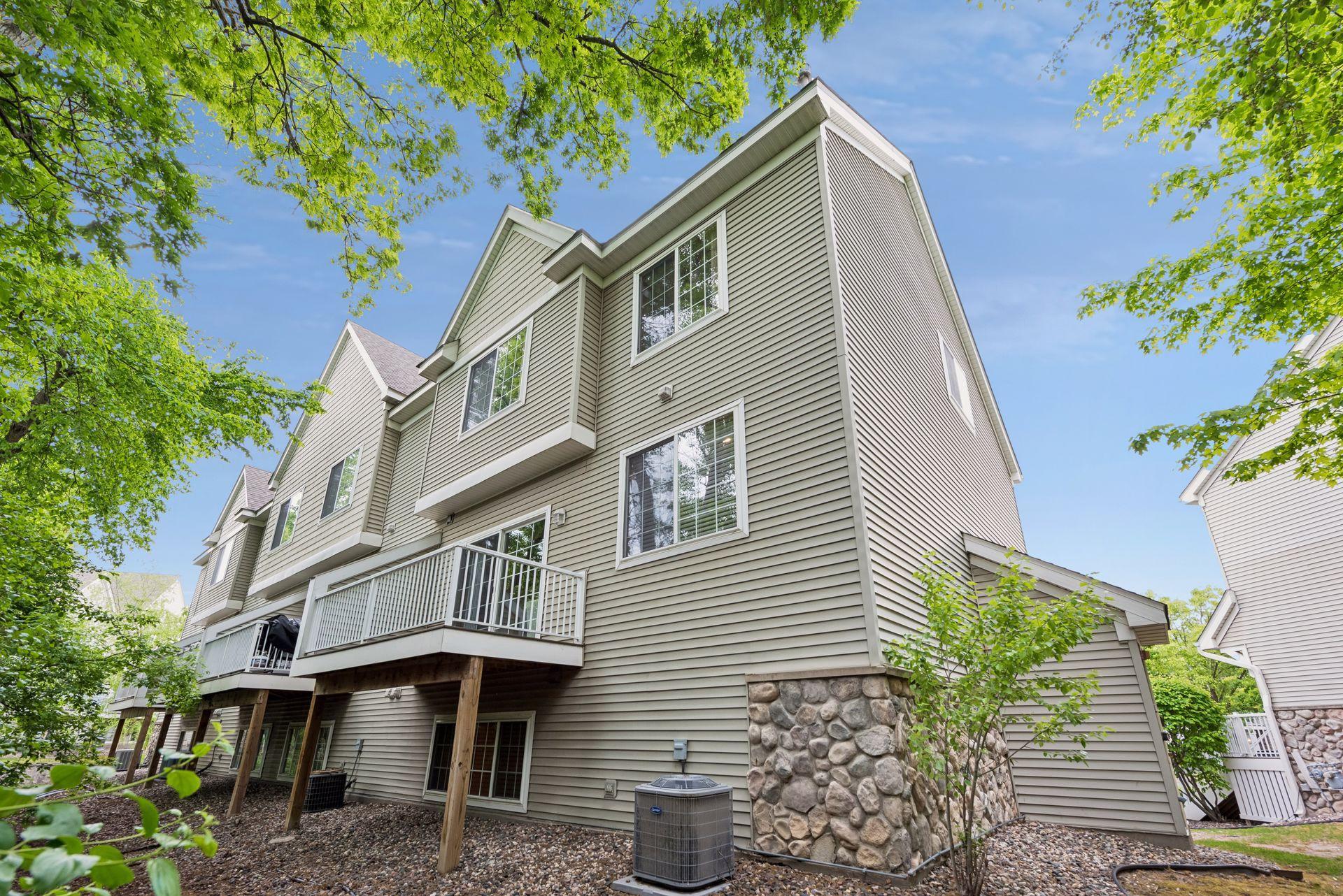 This end unit townhome backs to wooded privacy and pond with easy access to walking trail.