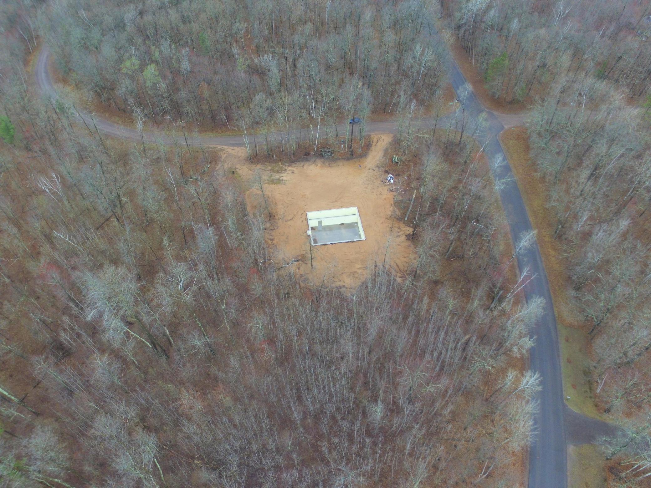 Drone view of the poured Basement & the 2.03 acres: Scroll for more detailed pics.
