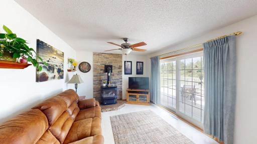 Great room w/cozy fireplace and walkout access to deck