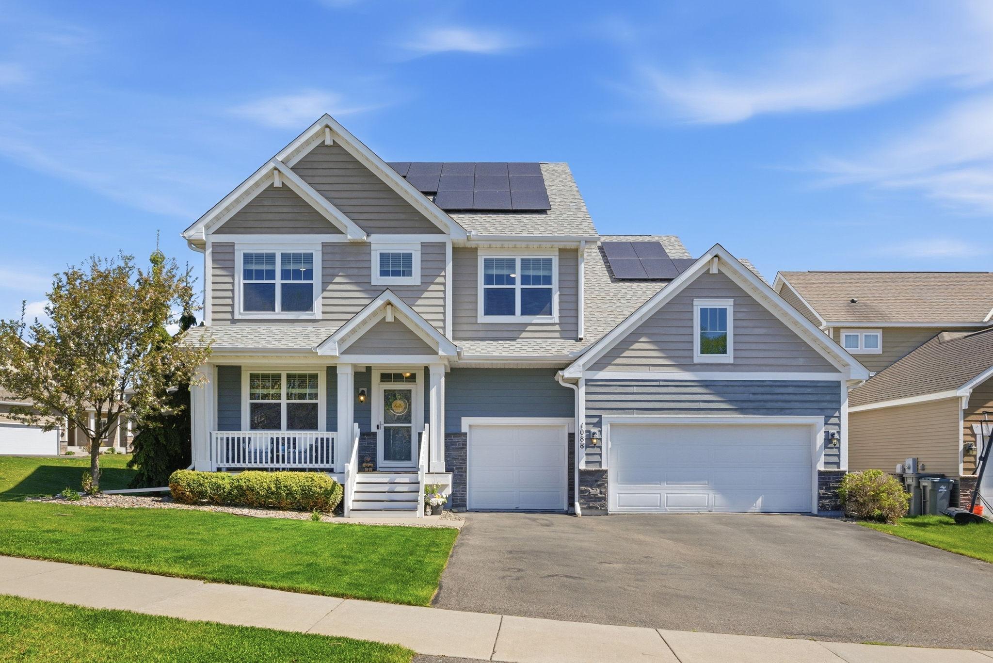 Beautiful two-story home with standout curb appeal, welcoming front porch, and energy-efficient solar panels for added savings and sustainability.