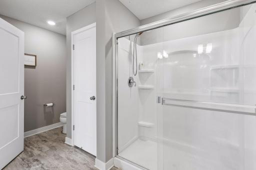 Walk-in shower and next door is a linen closet that is great for storing towels, necessities, etc.