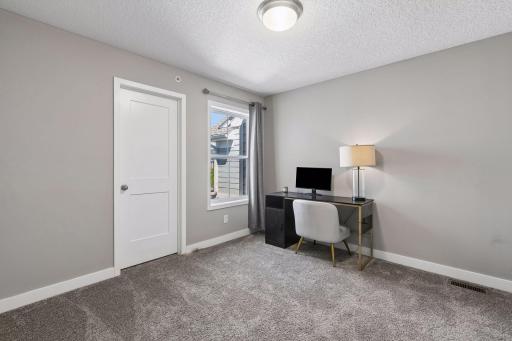 Bedroom #2 on the upper level that is very spacious and could have multiple uses.