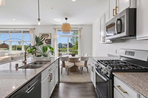 An angle where it shows the perfect dining area that overlooks the views out your sliding glass door.