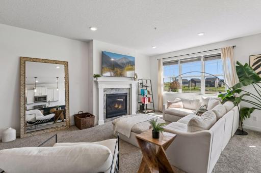 The natural lighting boasts this living area. Great fireplace for cozy movie nights.