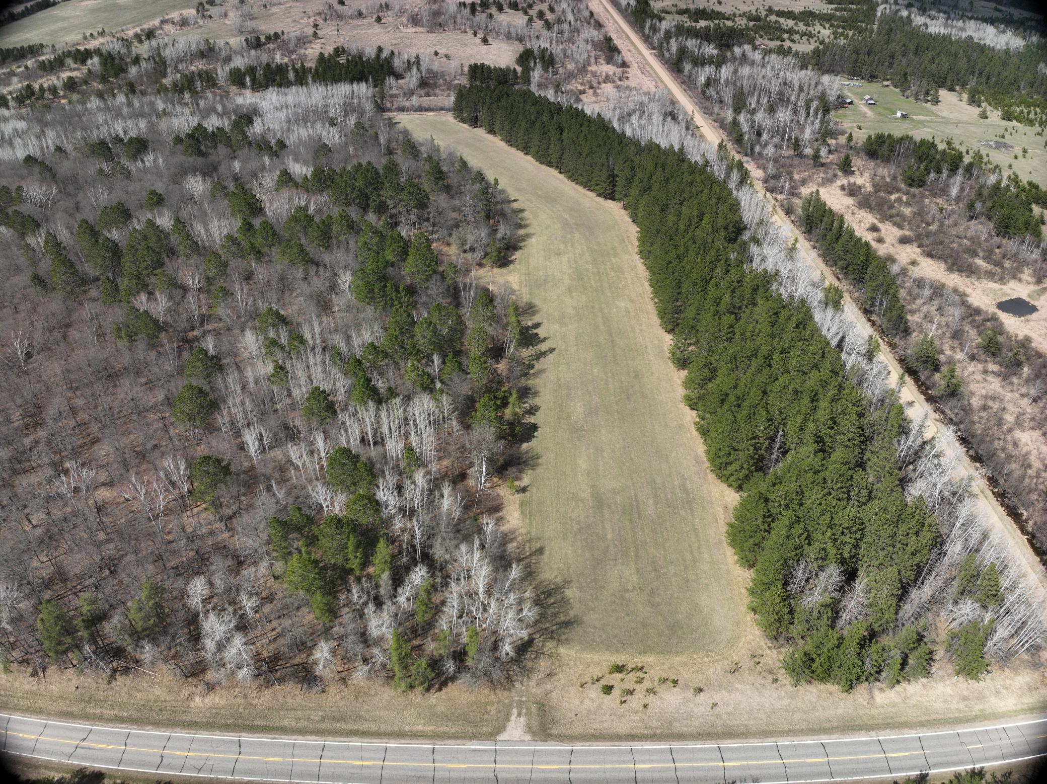 Paved road borders the south line .JPG