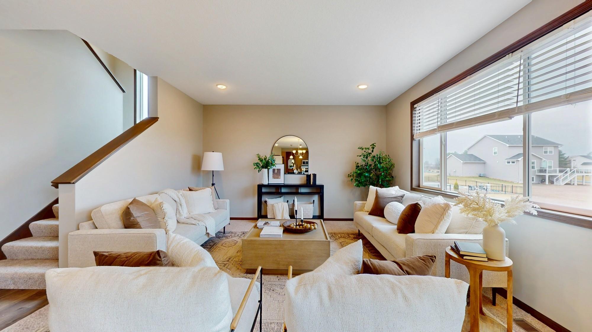 Beautiful living room with new carpet and paint.