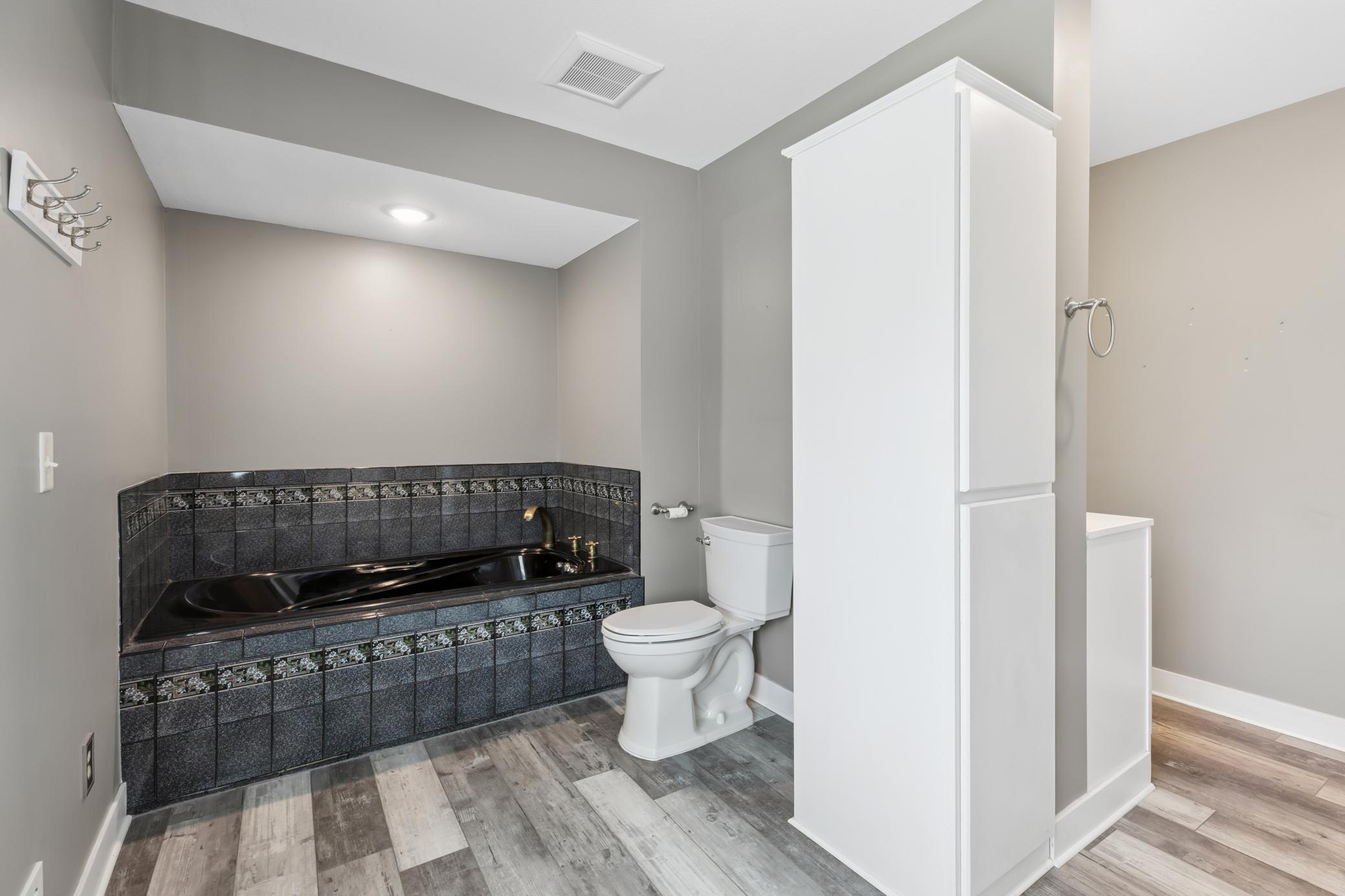 Soaker tub and stool in primary