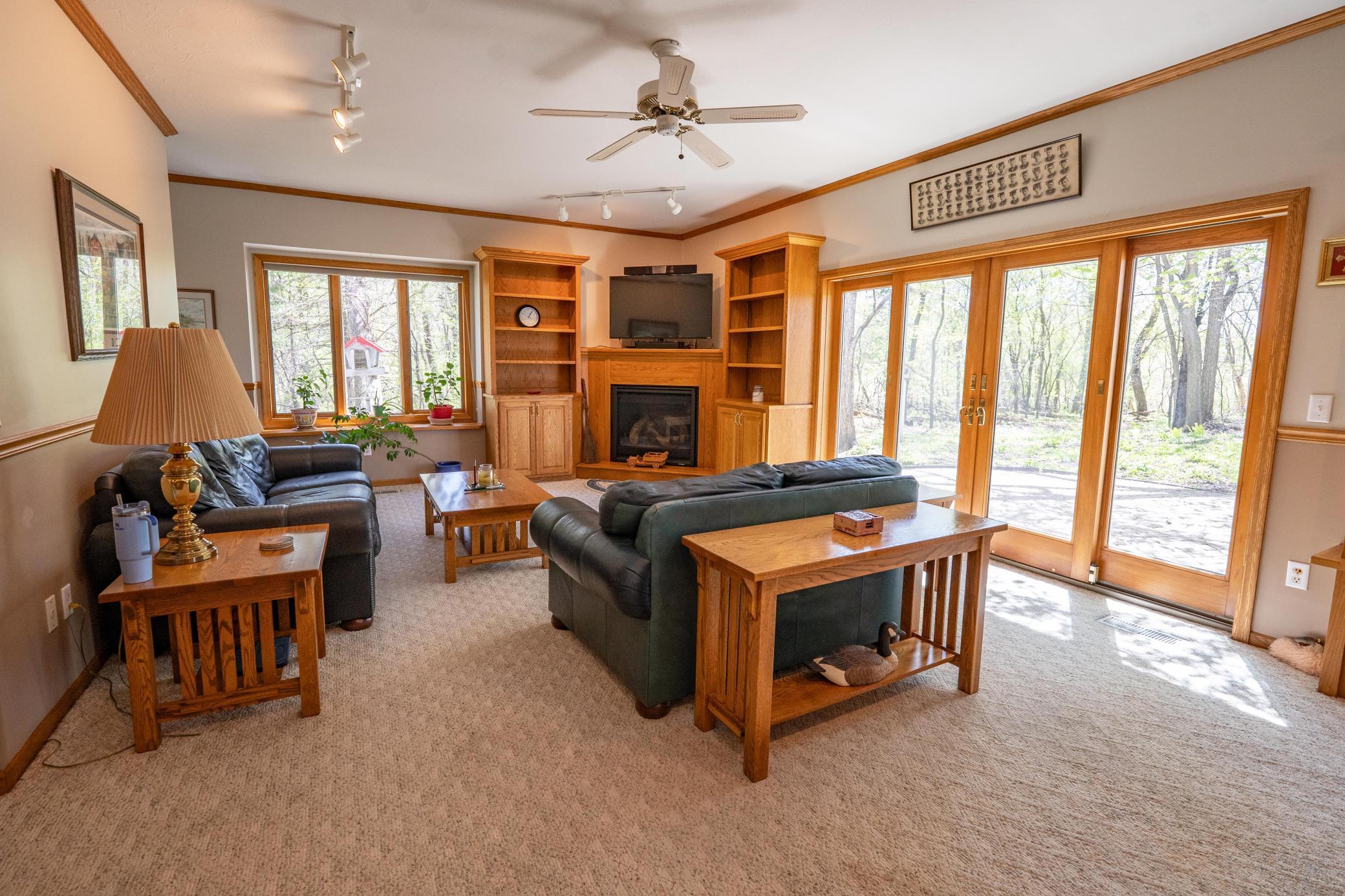 This is the family room off the living room and informal dining area. The Sliding glass doors lead to the backyard which is extremely private and a paver patio