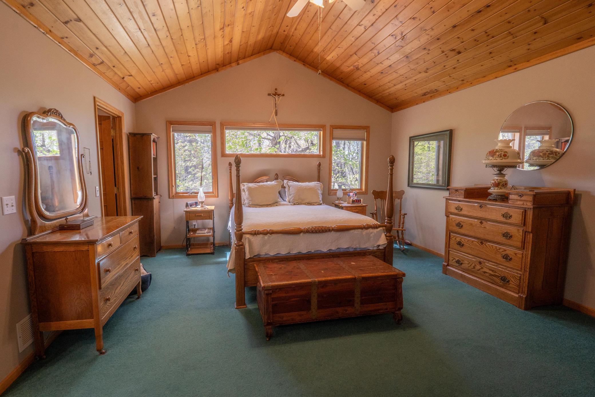 The primary suite features of vaulted wood ceiling, full private master suite bathroom and walk in closet. Not to mention stunning views from all of the windows