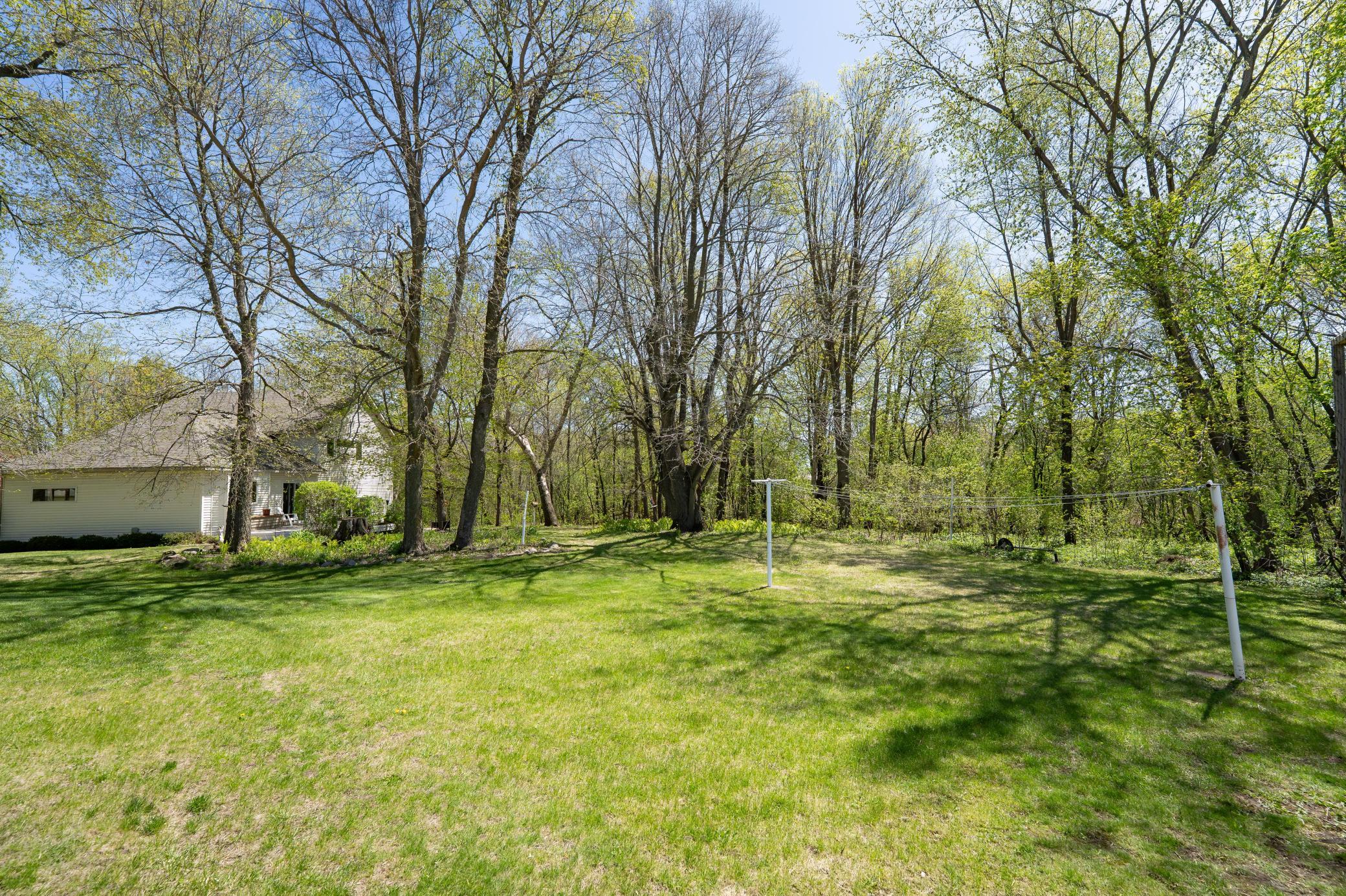 Off to the right of the garage is a huge open space where you can hang laundry. This would be a great place for a garden, fire pit or any other outdoor use you can think of
