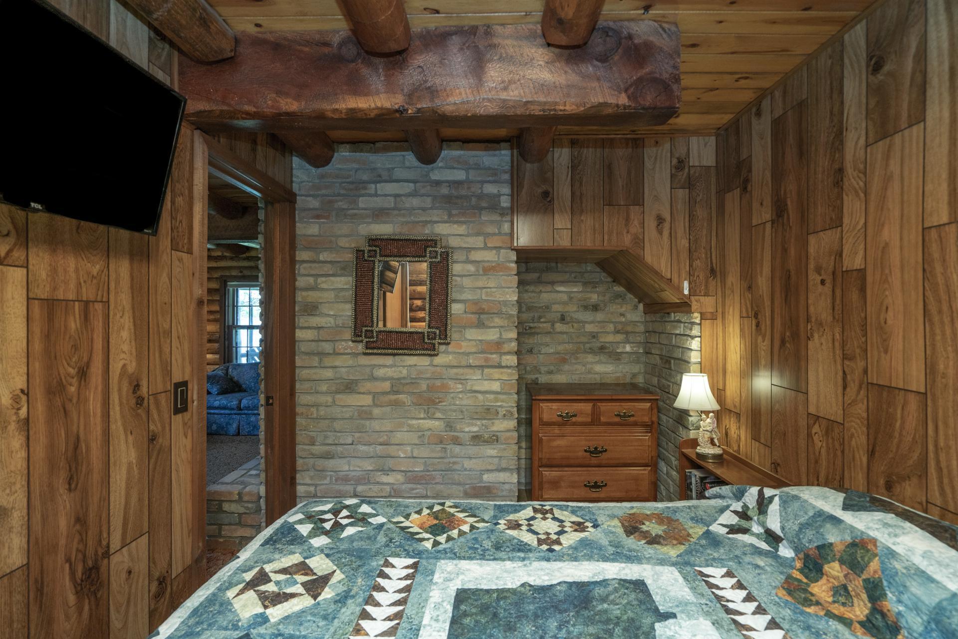 Exposed brick wall in Main Floor Bedroom