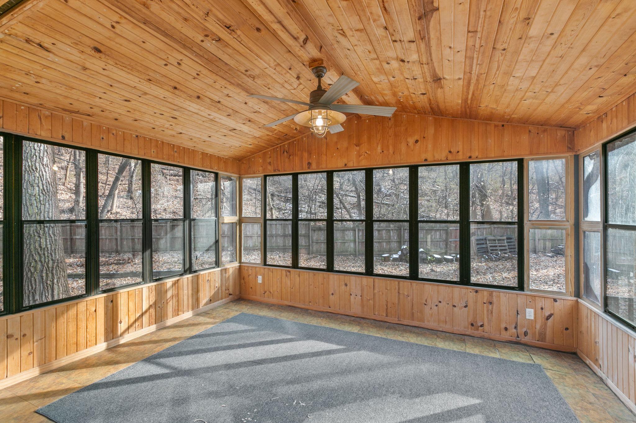 Awesome 3-season porch just off the dining room overlooking a fenced in back yard.