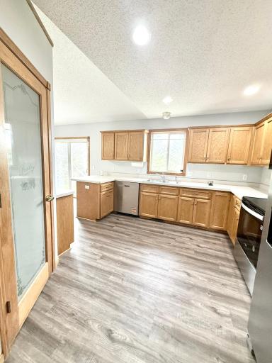 Kitchen with Ample Cabinet Storage and Brand New Stainless Steel Appliances