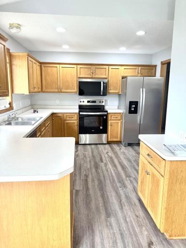 Kitchen with Ample Cabinet Storage and Brand New Stainless Steel Appliances