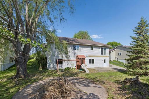 Generous Backyard and Cement Patio and Stamped Concrete Firepit Area