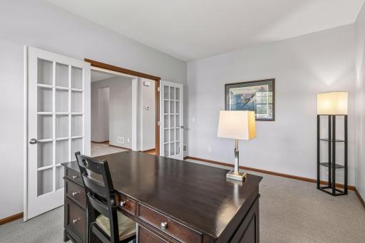 The French doors in the office provide privacy for calls but allow for visibility to the rest of the house.
