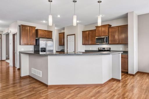 The massive kitchen island and breakfast bar is the hub of the kitchen and main floor.
