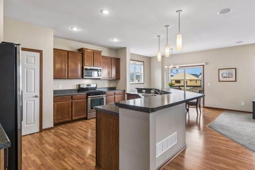 On the left you see the pantry. The kitchen also has recessed lighting and there are ceiling speakers.