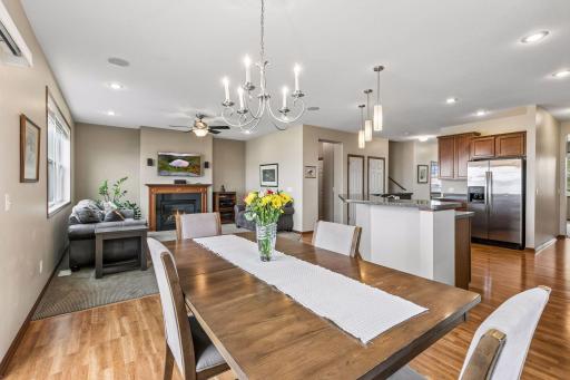 There is modern stainless lighting that coordinates with the stainless appliances in the kitchen.