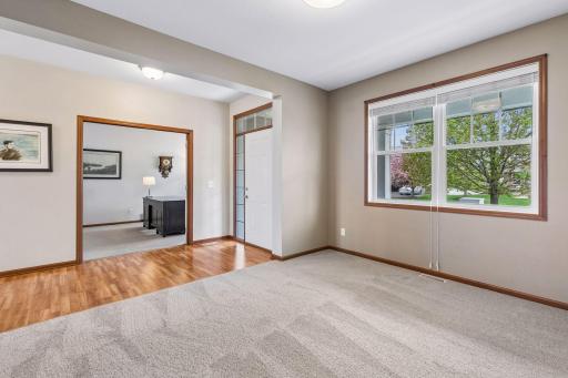 As you enter the home, to the right is a home office with French doors and to the left is a flex space.