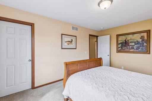 This bedroom has a walk-in closet and there is an additional walk-in closet in the hallways for storage.
