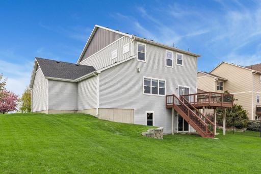From this rear elevation of the home you can see the wide expanse of lawn this home has.