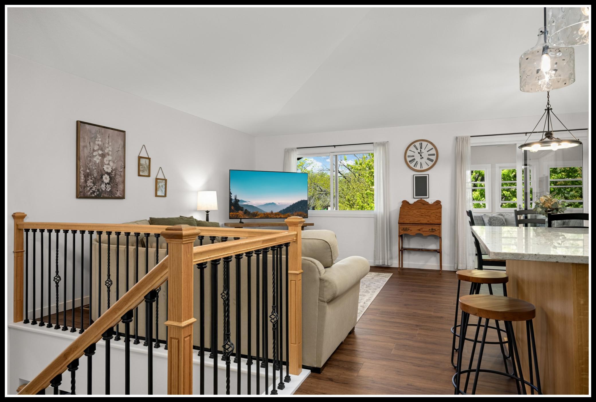 Upper level open floor plans includes kitchen, living room, and dining area