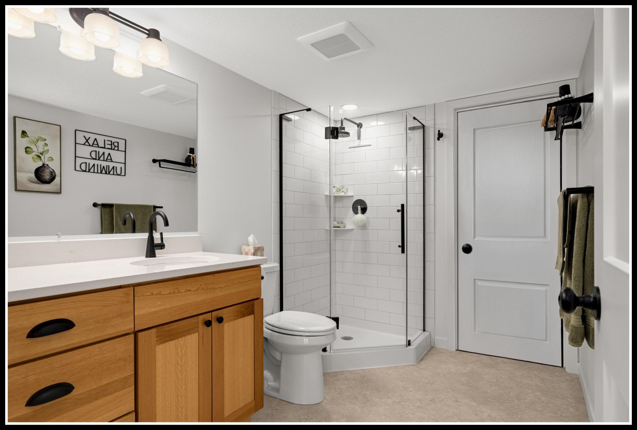 Three-quarter bathroom serves the lower level