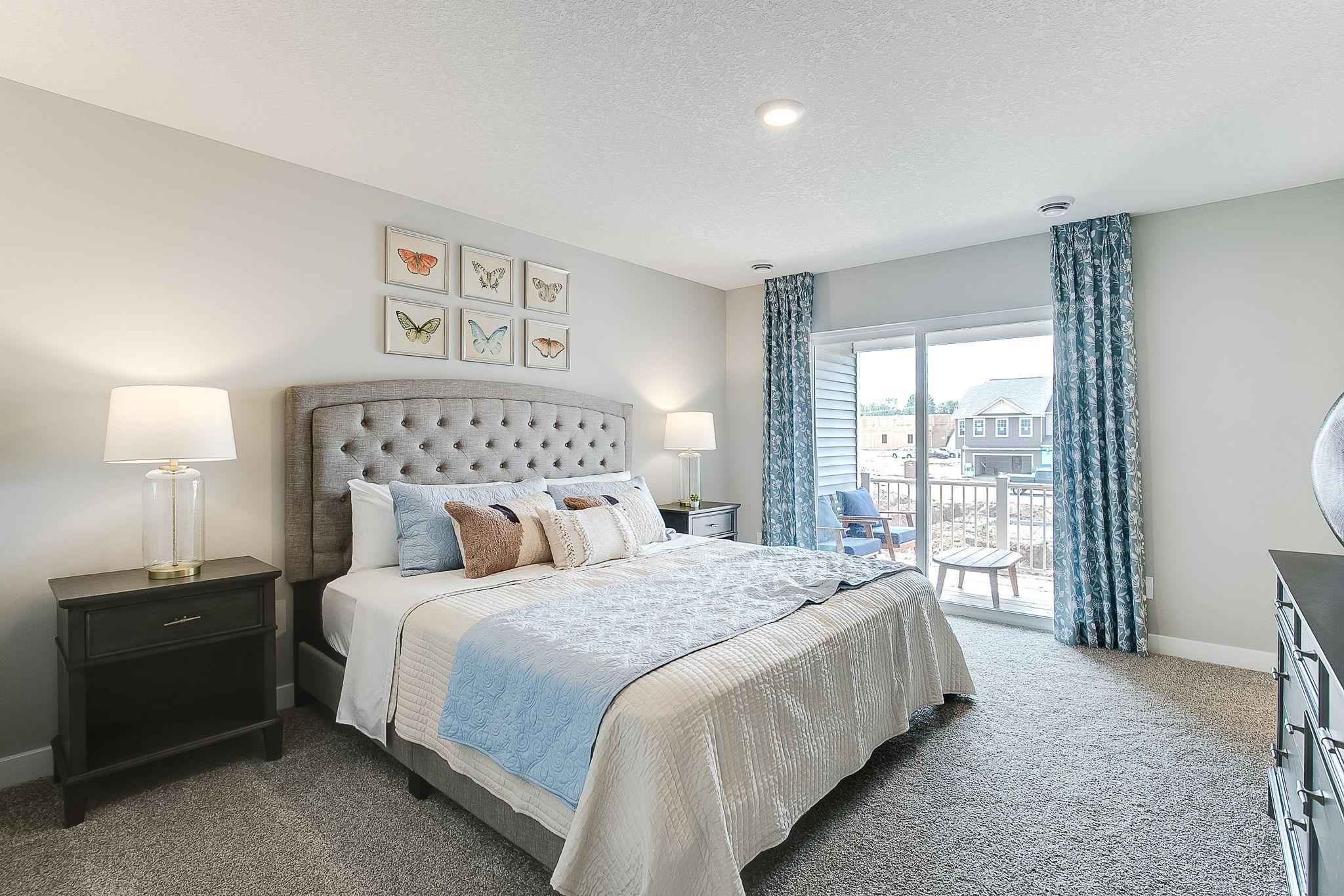 Primary bedroom easily fits a King and has its own private covered deck. Model photo. Options and colors will vary.