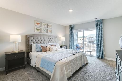 Primary bedroom easily fits a King and has its own private covered deck. Model photo. Options and colors will vary.