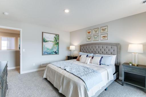 Primary suite. Large enough for all the King bed, dresser, nightstands, and more! Model photo. Options and colors will vary.