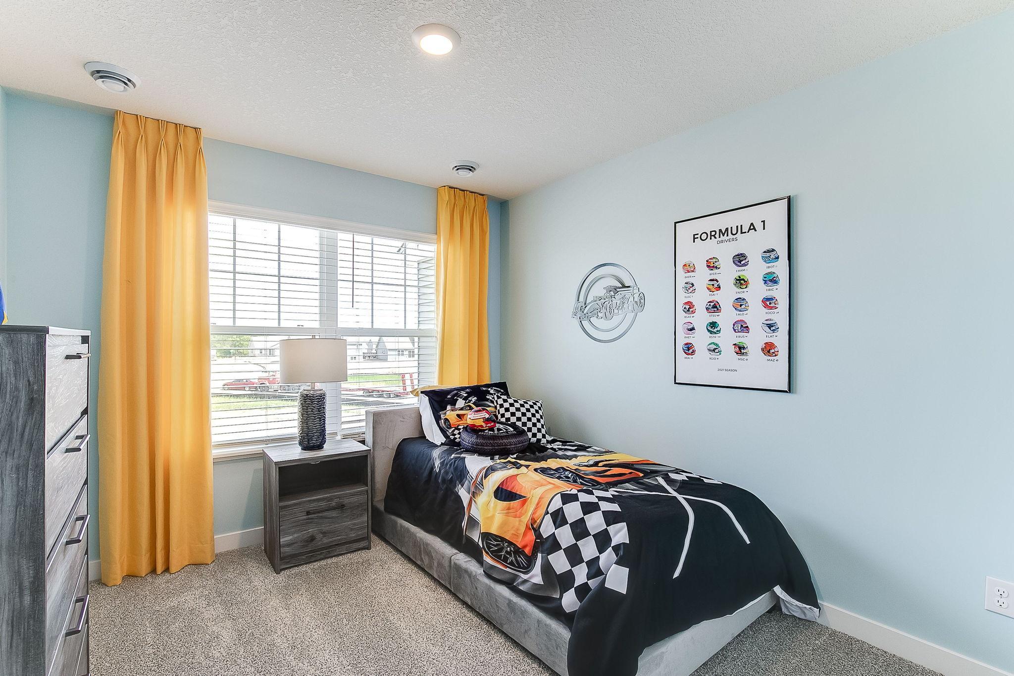 Spacious 2nd bedroom on upper level. Model photos. Options and colors will vary.
