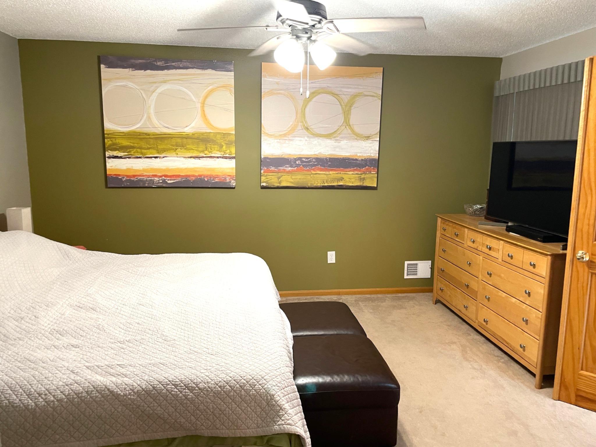 Primary bedroom. Blind above tv. Actually big window