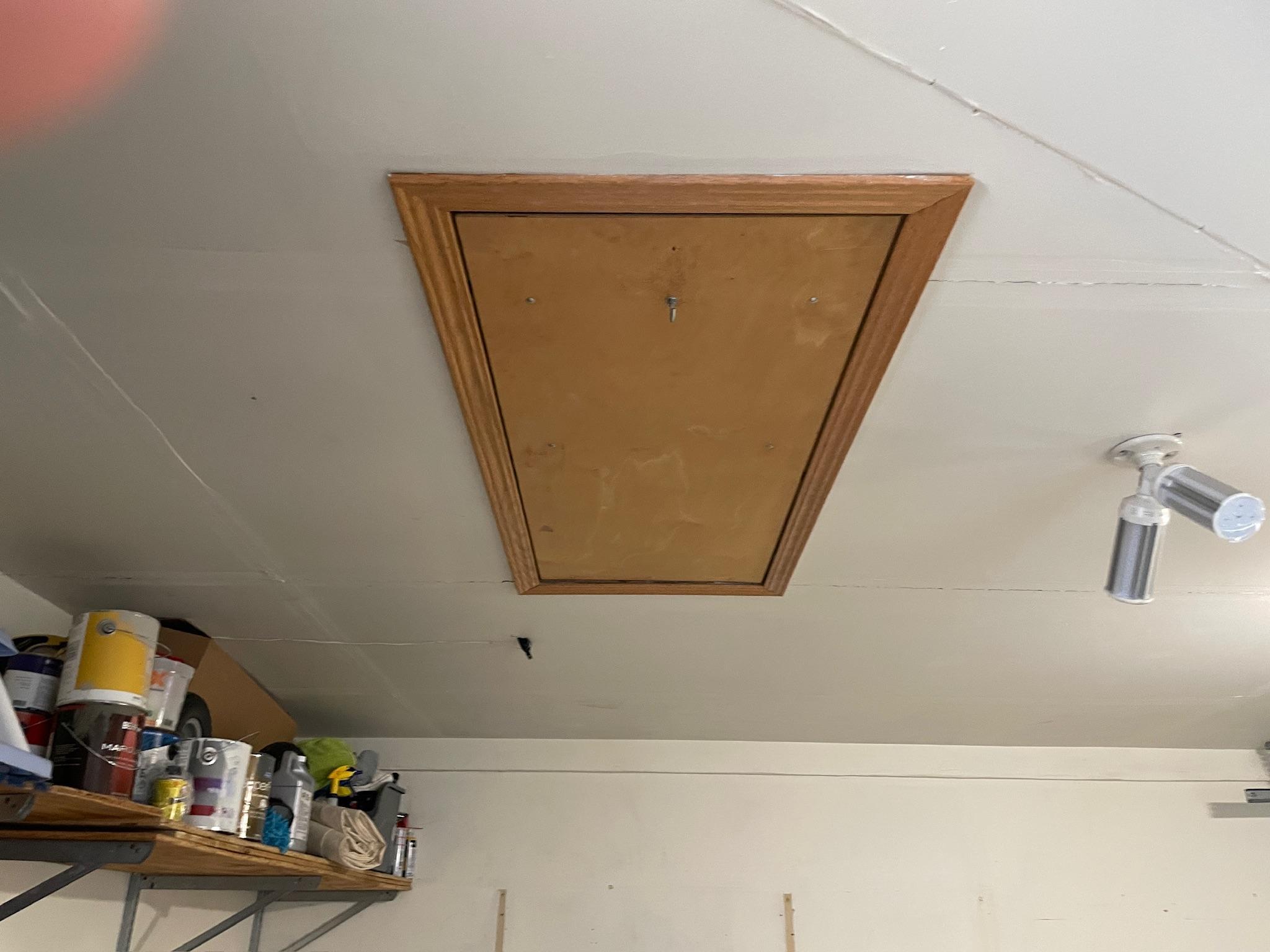 Pull down ladder to garage attic storage