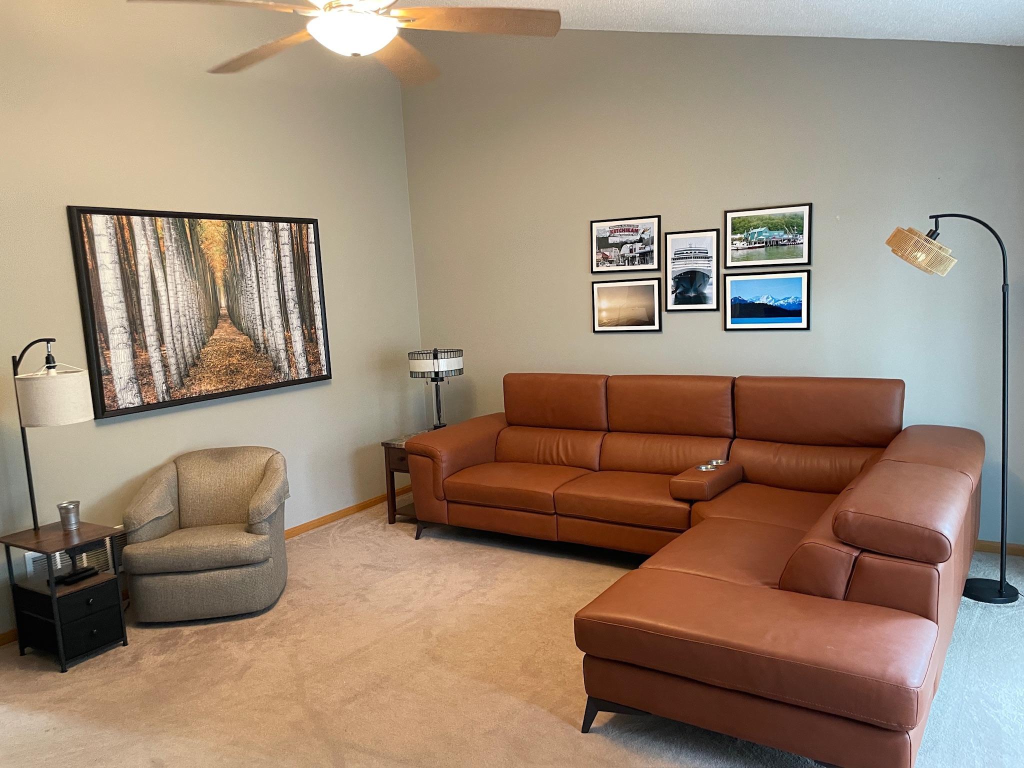 Very large vaulted living room with high end custom fan