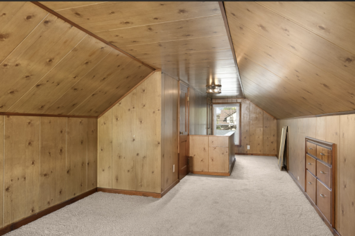 Pine walls and ceiling in the upstairs is super cute! Make this your cave!