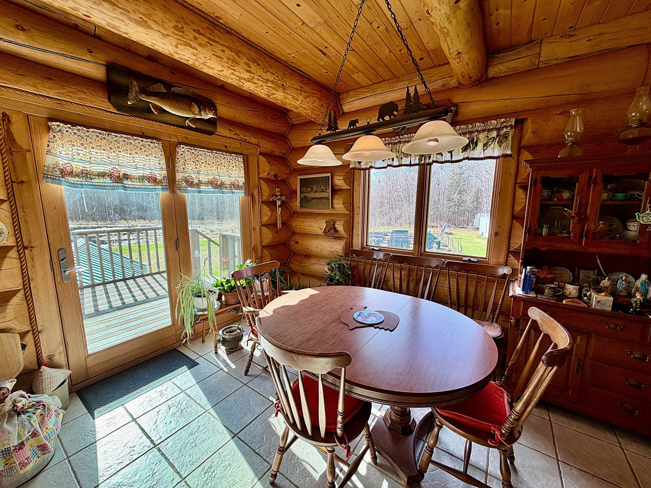 Dining room with doors to deck.jpg